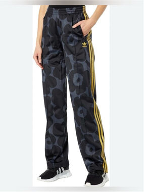 Adidas Originals X Marimekko Firebird Track Pants in a black and gold colorway